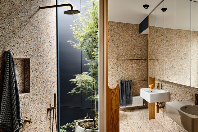 Dramatic: This singular use of terrazzo on the walls and floor of Kennedy Nolan’s Oak Tree House bathroom in Melbourne makes for a stunning resolve, dramatic thanks to its reflection in the generously sized vanity mirror. The sandy, speckled finish lends the small room an immersive quality evocative of a breezy seashore.
