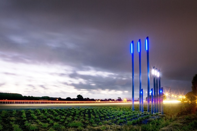 Blue poles lit with blue lights add contrast at the southern end of the approach to the Whanganui Gateway.