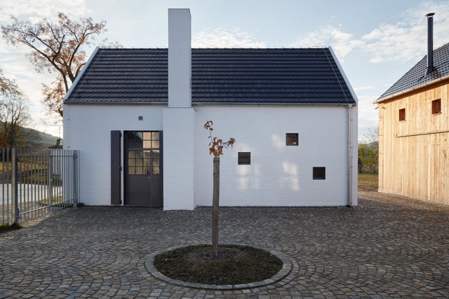 Javorník distillery in the Czech Republic by ADR studio. A modern aesthetic with a traditional nod plays out in the contrasting black and white palette and choosing of materials.