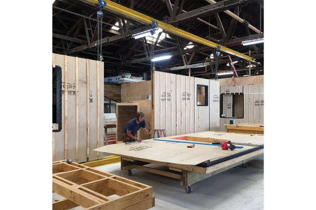 Factory construction of CLT floor and roof panels, in conjunction with 140mm pre-framed and clad walls, for the Waitarere Beach Bach.