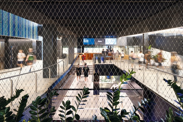 A ramp gently leads the student visitor down to Reception, which overlooks the aquatic hall behind.
