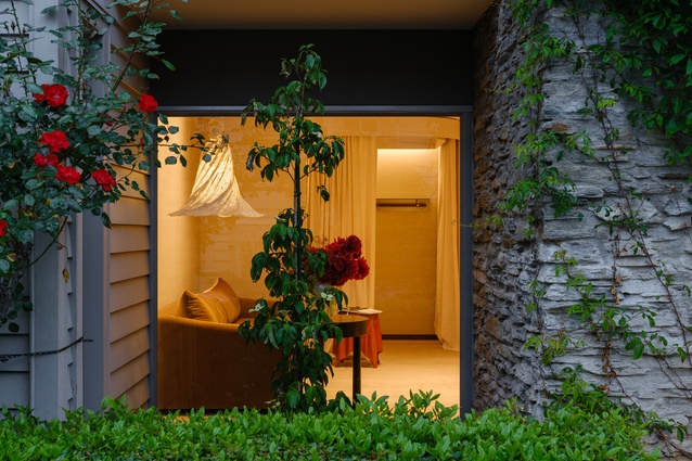 The pendant lights in the fitting rooms seen from outside. 