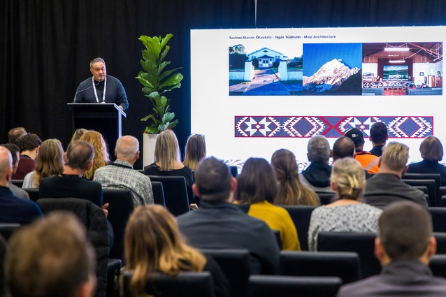 Huia Reriti speaking at the BuildNZ 2023 conference. He was invited to be a keynote speaker alongside Debbie Tikau of Tipu Design.