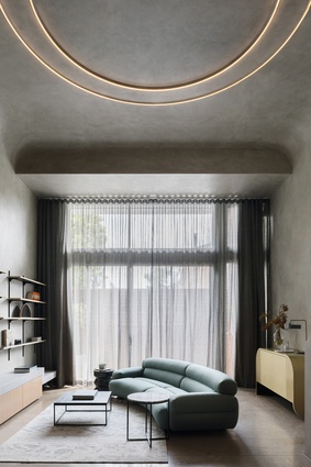 Furniture in the lounge area incorporates curve motifs that can be found throughout the apartment.