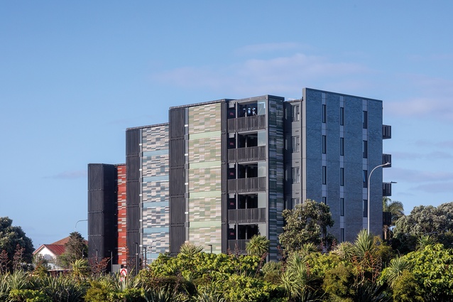 The south-western side of the development features colourful louvres around the rear circulation areas, and the lift and stair lobbies.