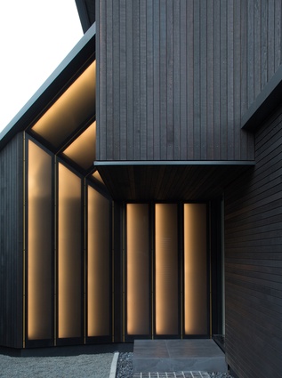 The narrow cedar board cladding on ‘The Tailored Home’ suggests a finely woven suiting material.