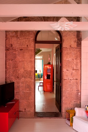 Exposed original brickwork lends some rustic flavour to the bright house.