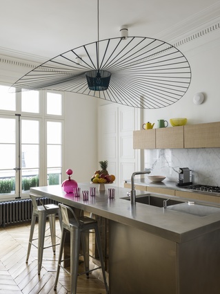 The kitchen features Constance Guisset’s Vertigo lighting.