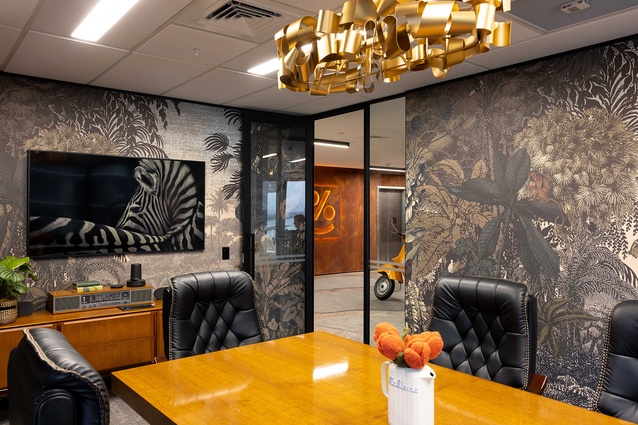 The board room is wallpapered in ‘Dreamlike Landscape’ by Casadeco from James Dunlop.