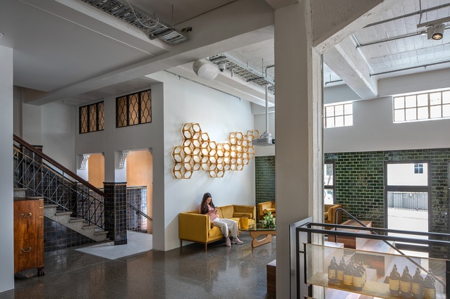 The original character of the building has been retained in Antipodes’ headquarters. In its retail space, brass window frames and a formidable stairwell cohabit with modern additions.