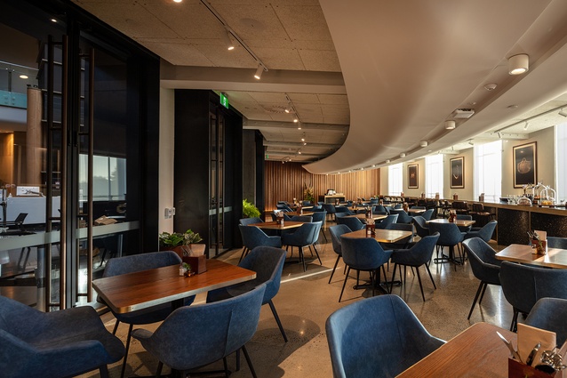 The elegant Jasmax-designed ‘shield’ carries the services across the  bistro’s ceiling.