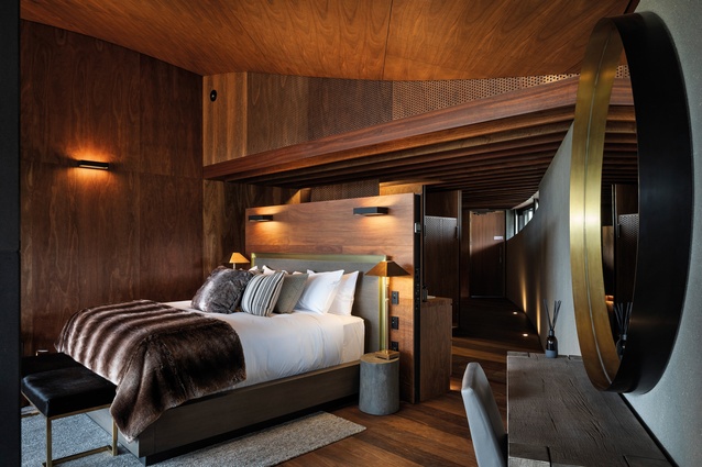 Pictured is one of five high-ceilinged, plywood-panelled, luxury bed suites.