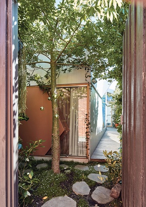 The house hugs the boundaries of the block, with pocket courtyards providing a garden outlook to every room.