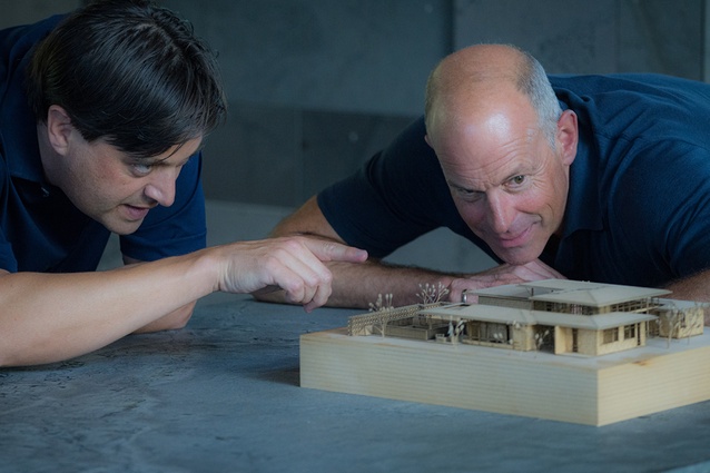 Spencer viewing a detailed model of Volcano House in Auckland with the architect Tom Rowe of RB Studio.