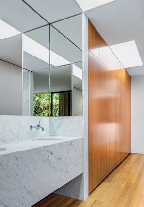 The main bedroom, ensuite and walk-in robe are arranged around a passageway, creating a fluidity of space.