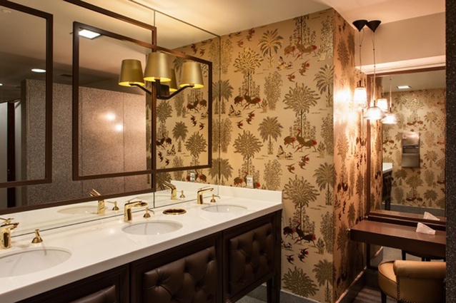 Restrooms with touches of art deco and TV series <em>Mad Men</em>.