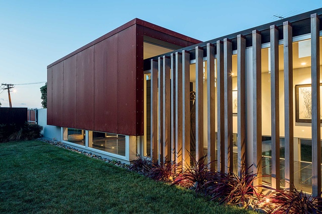 The house is designed as a series of boxes placed next to each other over three floors.