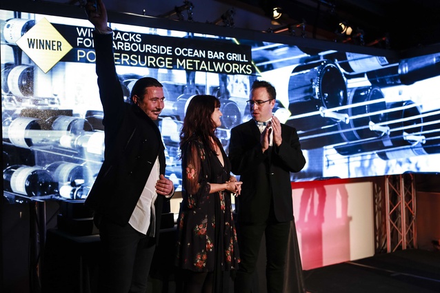 Todd Stevenson and Andrea Harradine receiving Craftsmanship Award from Federico Monsalve, editor <em>Interior</em>.