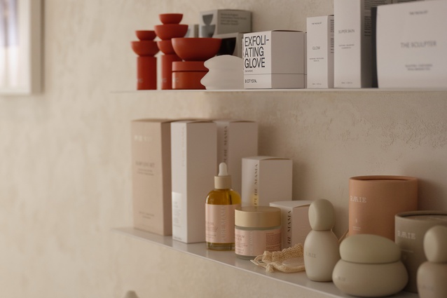 The product display shelf blends into the Hand-rendered plaster. 