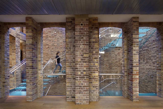 Apple Store, Covent Garden. The building's interior has been fully restored and bears the hallmarks of Victorian era construction such as wrought iron beams and rustic brick walls.