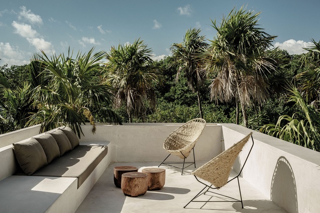 The home is respectful and referential to its jungle setting, using woven textures and natural fabrics wherever possible.
