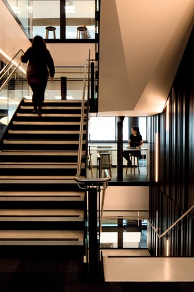 "The focal point of the stairs is a dramatically-lit black backdrop, while adjacent hub spaces were designed, again, to encourage social interaction."