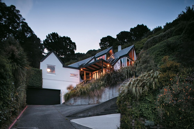 The Kimber's Seatoun home from the road. Its roofline follows the shape of the slope it is built into.