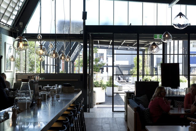 Although the architectural skeleton of the City Works Depot has been softened in this eatery, much of its industrial past remains, giving this interior an intriguing tension of opposites.