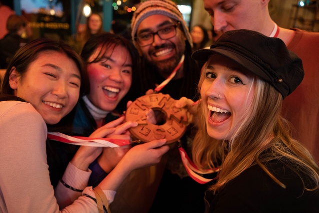 Team 10 shows off Adam Collet's multi-piece medal.