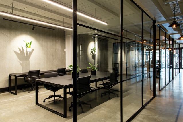 Black powder-coated steel partitions are used throughout.