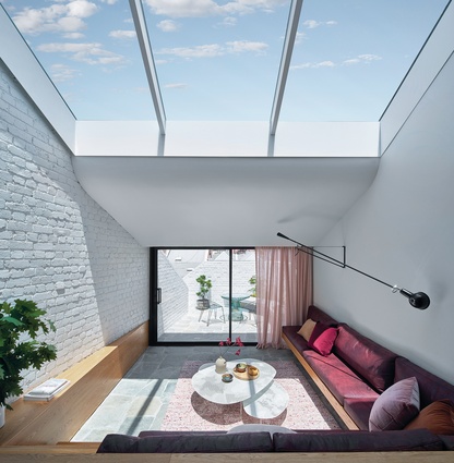 The generous skylight delineates the dining room and sunken lounge, while also exaggerating volume within the living area.