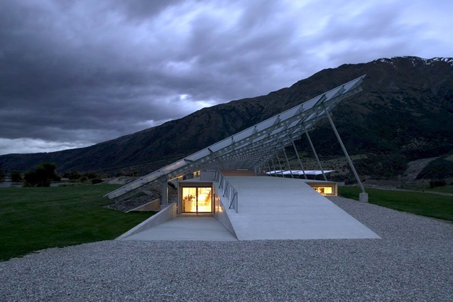 Peregrine winery in Otago, New Zealand by Architecture Workshop. A concrete entrance ramp leads you down to where the wine-making takes place and the roof provides and extra weather-proofing measure.