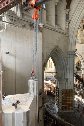 One of the limestone mullions on the South transept gable being prepared for removal.
