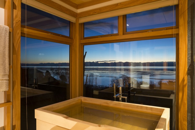 The soaking tub has pride of place, taking full advantage of the view. 