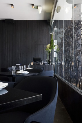 Dark tones add commute an elegance and refinement to the restaurant. 