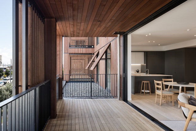 Cedar semi-enclosed balconies with sliding timber screens bust out to the park and the western sun, and add a sense of craft to the ‘pavilion’ apartments.