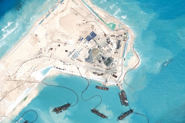 Chinese dredgers have created a land mass that spans the entire existing Fiery Cross Reef. An airstrip is currently under construction.