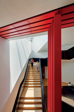 Twin ascending and descending staircases lead to and from the exhibition space, which involved excavating 22,500m<em3</em> of earth beside the existing Grade 1-listed building.