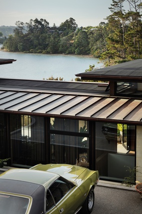 The low-profile positioning of the house in the landscape means the roof plane can be seen so it was important to maintain the aesthetic. The lower roofs are copper tray with half-round copper guttering and copper rainwater heads. 