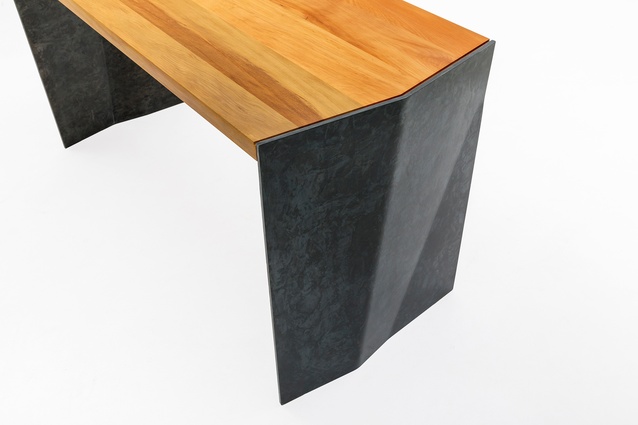 The desk's legs are made from aged, blackened steel chosen for its colour and patina, and the way it cast shadows.