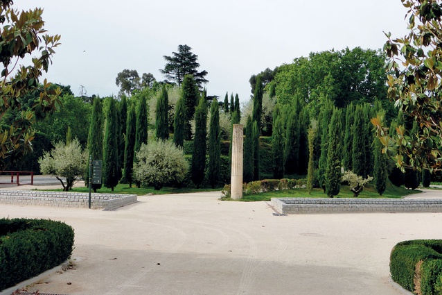 Planted with olives and cypress, the garden memorial incorporates a spiral path into its summit. 