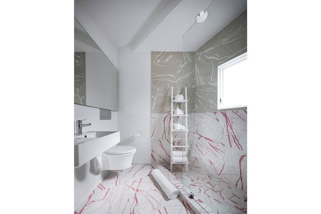 Faux materials abound in this home’s interior, including marble finishes in the bathroom made of vinyl and cartoonish drawings, rather than the oft­-desired, real Italian marble.