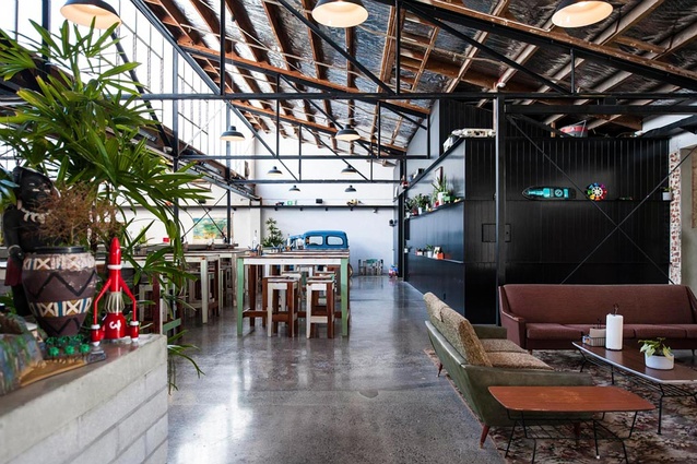 Brothers Brewery and Juke Joint in Auckland, New Zealand by MA Studio. Black steel beams and exposed brick compliment the industrial framework of this brewery.