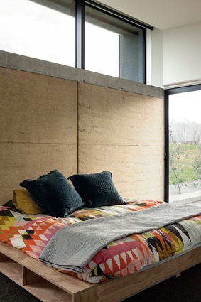 Rammed-earth House: Earth from a local source is used to make the earth walls.