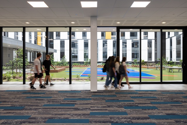 Floor-to-ceiling glazing creates a visual connection across public spaces.