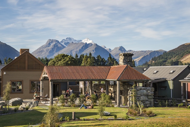 Among many energy- and waste-saving technologies, and well-designed spaces, at Camp Glenorchy, there is a Scheelite stone shelter outside, where guests can sit by the fire.