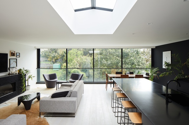 The view of a canopy of trees at the rear of the living space can be seen as soon as you open the front door. 