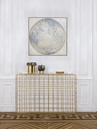 The painting is <em>Lune Blanche</em> by Denis Perrollaz. The brass console is the Cottos model, designed by Jean-Louis Deniot for Pouenat. The brass and ceramic vases are by Sophie Dries.