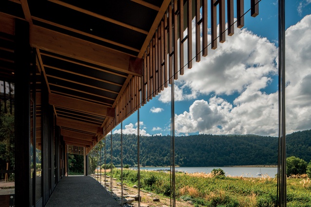 The building amidst its natural setting, nestled right next to the shores of Lake Waikaremoana.