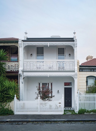 The multifaceted addition is neatly hidden behind the restored Victorian terrace frontage.